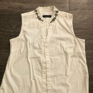 Ivanka Trump white button-down sleeveless top
